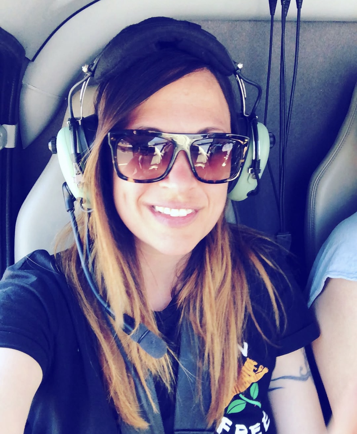 Fabiana Ciatti wearing a headset and sunglasses